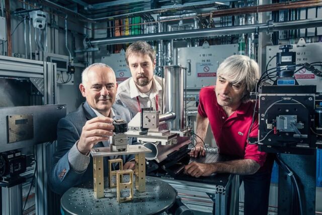 Brent Seales, Seth Parker, and Michael Drakopoulos at the particle accelerator.