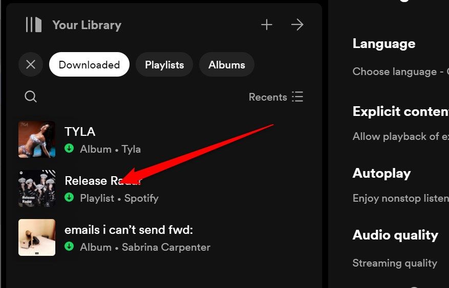 The Spotify 'Your Library' section on the desktop app with the 'downloaded' button highlighted indicating that it is filtering the results