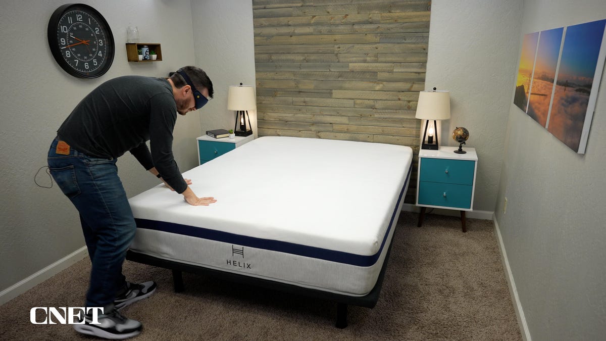 Owen testing the feel of the Helix mattress.