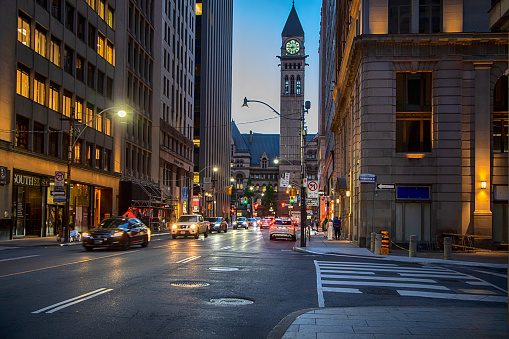 TORONTO, CANADA - August 11, 2022: Downtown Toronto with view of Old City Hall with tower clock.