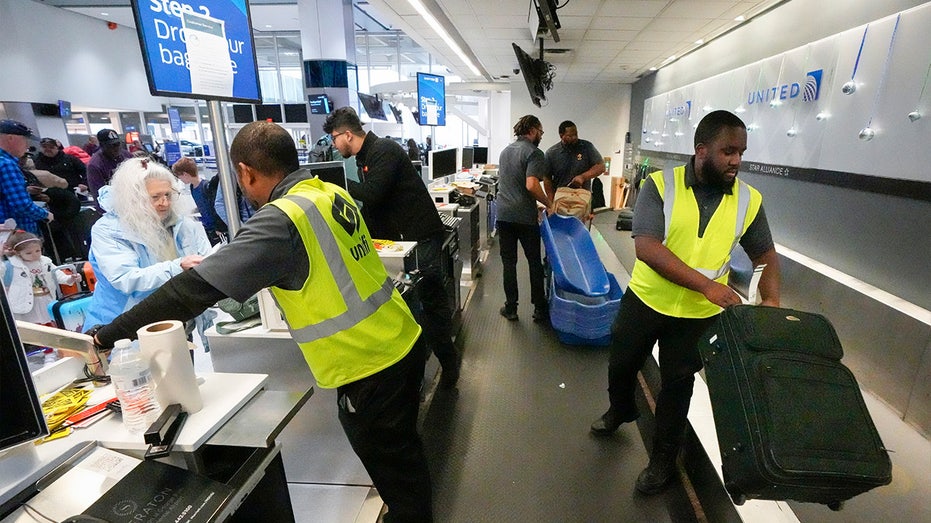 Passenger drop off their baggage