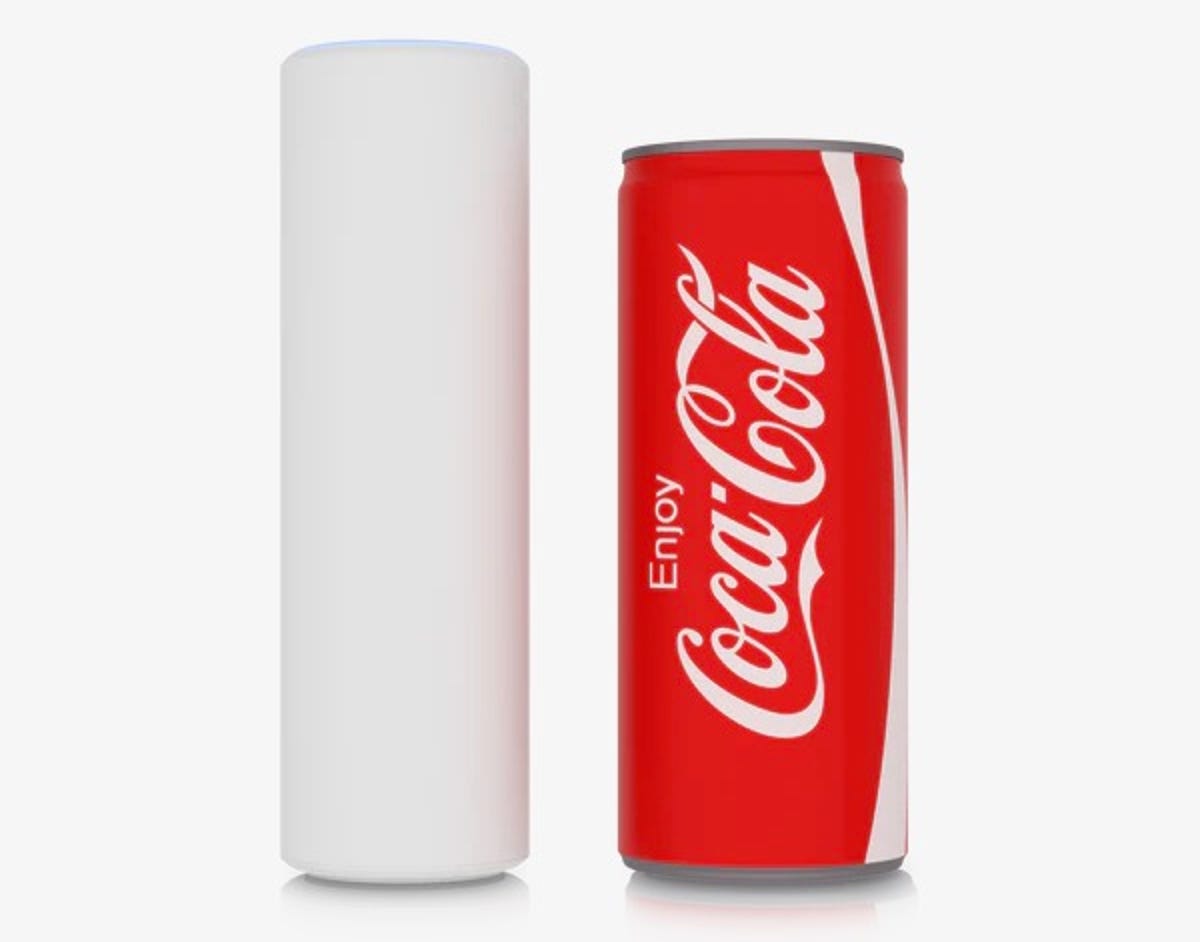 Access Point U6 Mesh stands just a bit taller and thinner than a Coca-Cola can (which is standing next to it).