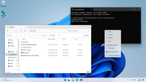 Desktop with open folders and command prompt showing an ARM CPU.