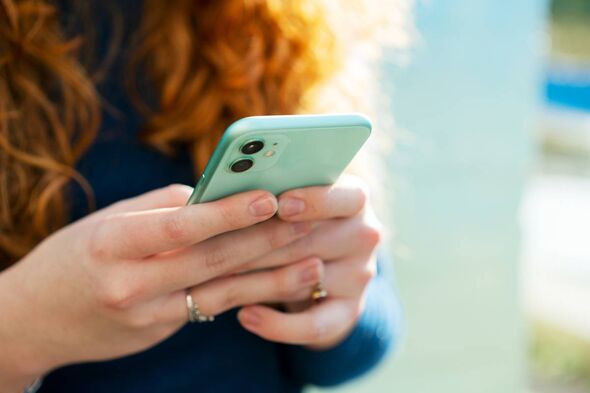 Woman texting on her phone