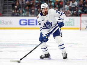 Conor Timmins of the Toronto Maple Leafs skates against the Seattle Kraken.