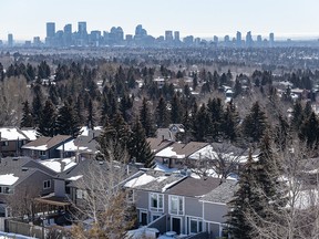 A view of the Calgary skyline with suburban houses in the foreground was photographed on Wednesday, March 22, 2023.