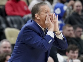 Kentucky coach John Calipari calls out to the team during a game.