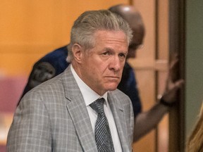 Tony Accurso walks through a courthouse hallway