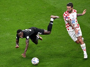 Richie Laryea of Canada battles for possession with Marko Livaja of Croatia during the FIFA World Cup Qatar 2022 Group F match between Croatia and Canada at Khalifa International Stadium on November 27, 2022 in Doha, Qatar.