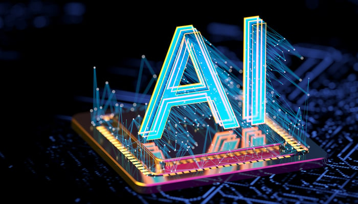 A hologram of the letters AI projected above a computer chip.