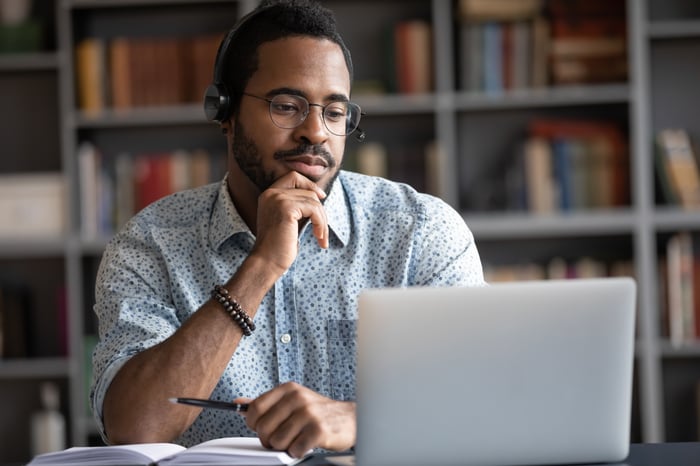 A person studying on their laptop.