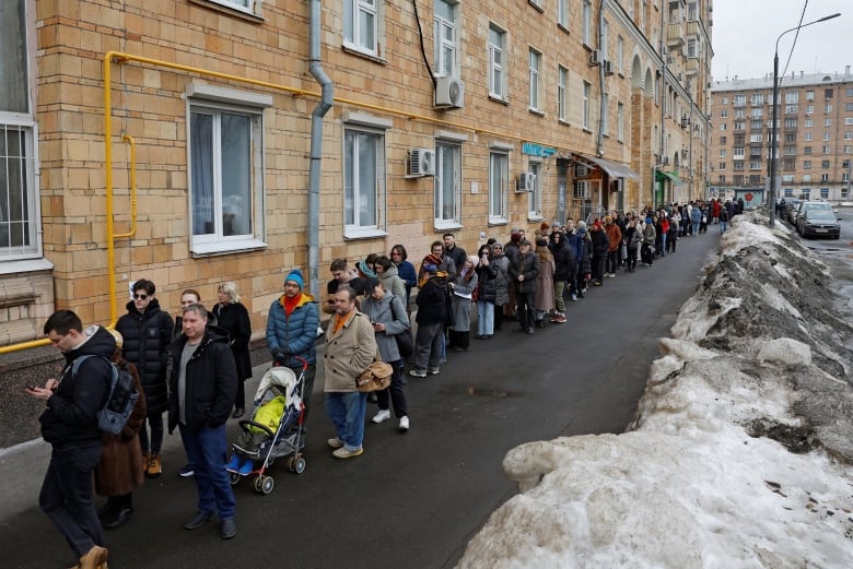 A lineup of voters outside a polling station in Moscow.