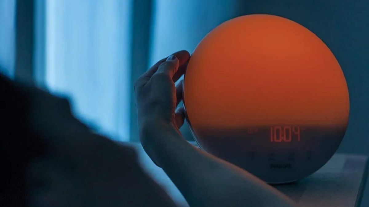 Person using SmartSleep clock at night