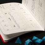 A notebook with D&D details and dice below it