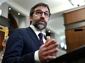 Steven Guilbeault speaks at a lectern