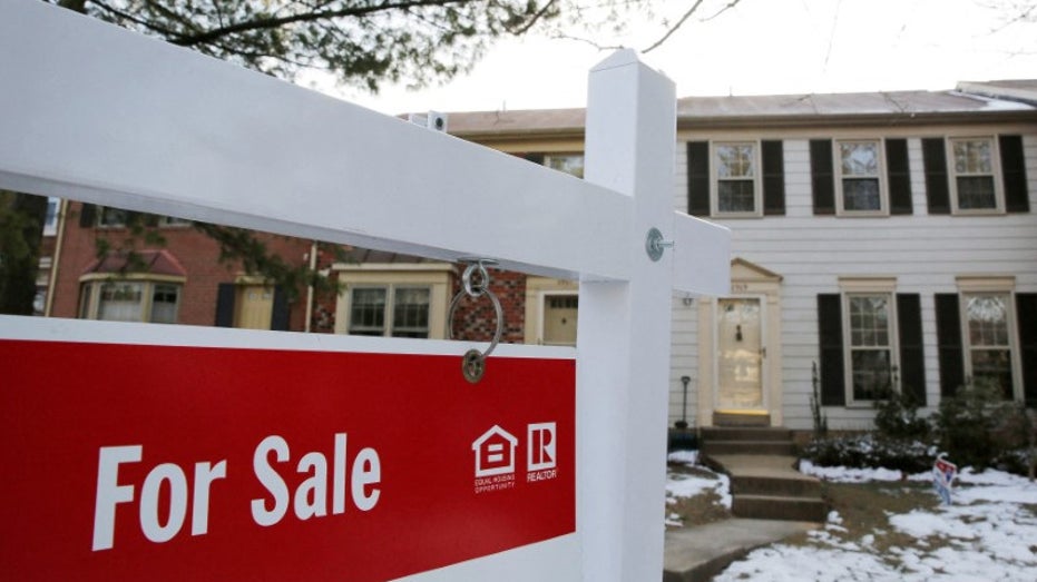 For sale sign in front of home in show