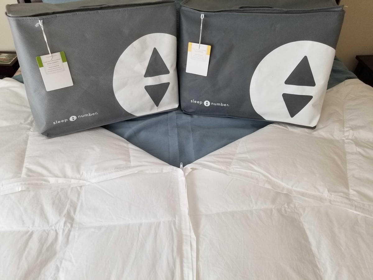 Sleep Number Zip comforter on bed with a packaging