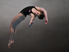 Kate Miller curves backward to begin a dive