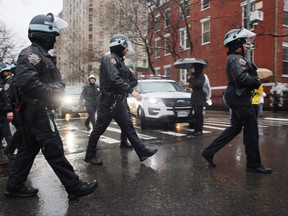 Police gather as people participate in a demonstration and march to demand that Israel end its war in Gaza and agree to a cease-fire on March 2, 2024 in New York City