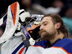 SEATTLE, WASHINGTON - MARCH 02: Stuart Skinner #74 of the Edmonton Oilers looks on during the second period Kraken at Climate Pledge Arena on March 02, 2024 in Seattle, Washington.