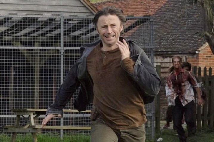 A man runs from zombies in 28 Weeks Later.