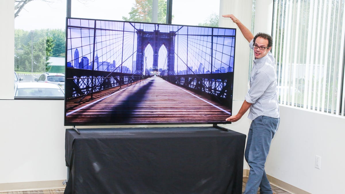 Editorial Director David Katzmaier stands next to an 85-inch TV.