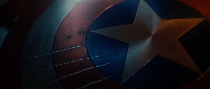 Captain America's shield with claw marks.