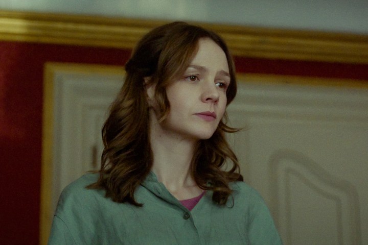 Carey Mulligan stands near a door in Spaceman.