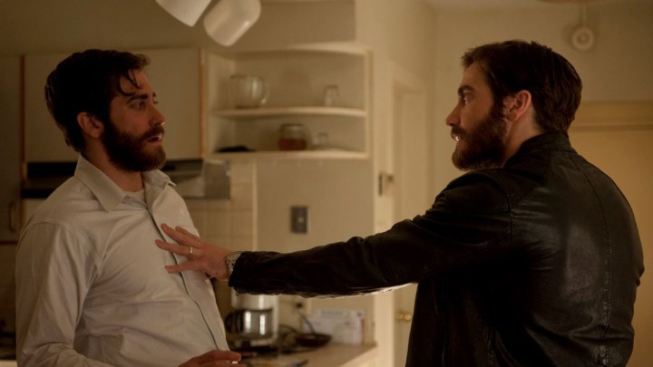 Jake Gyllenhaal pushes an identical Jake Gyllenhaal in a still from the movie Enemy