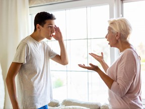 Mother and her teenage son arguing at home