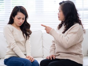 Image of Asian mother and daughter at home