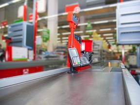 Cash desk with payment terminal in supermarket