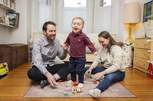 A photo of a couple with their child