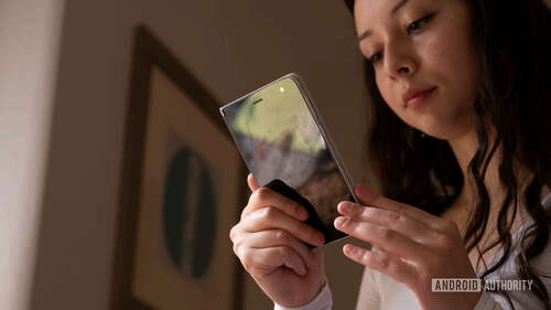 Microsoft Surface Duo in hand flipped around