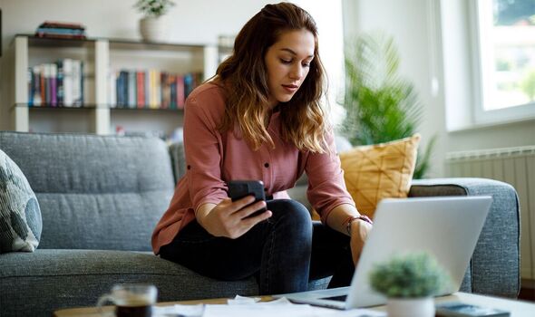 Woman calculating finances at home