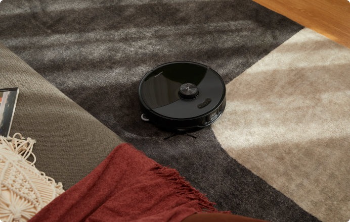 The Roborock S8 MaxV Ultra vacuuming.