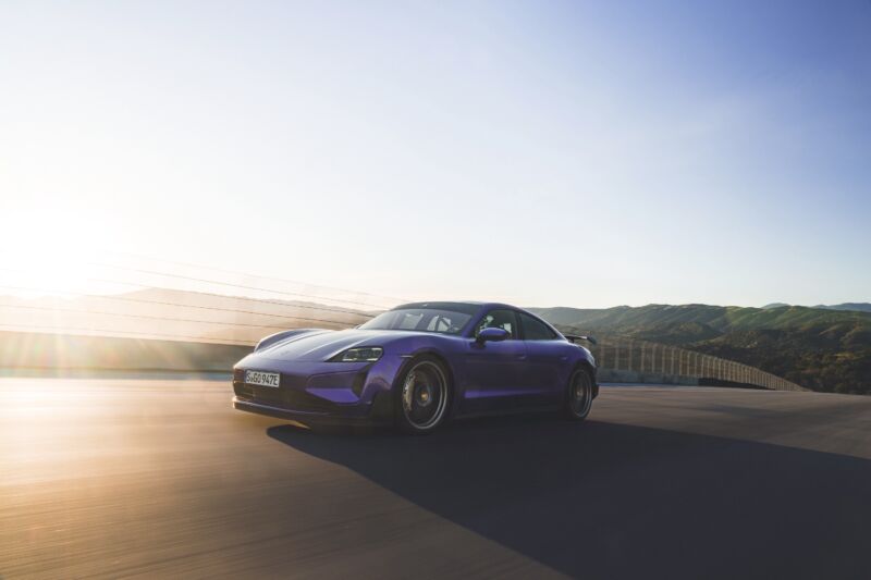 A purple Porsche Taycan at Laguna Seca