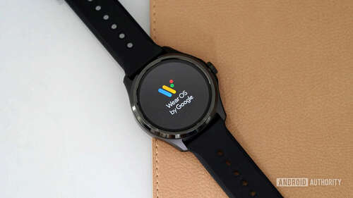 A TicWatch Pro 5 displays the Wear OS logo on screen.