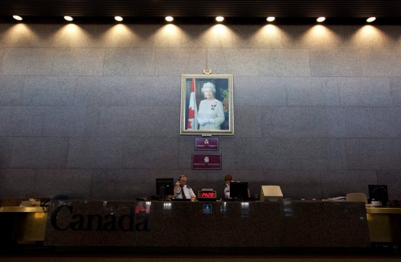 A portrait of the Queen hangs on the Sovereign's Wall at the entrance to the Department of Foreign Affairs building in Ottawa