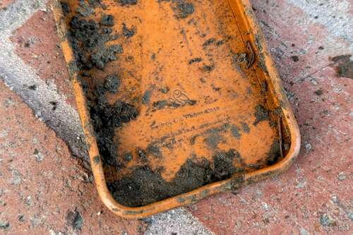 Bellroy Bio Phone Case with mud on it