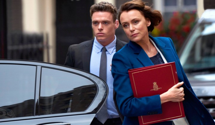 A woman and a man get out of a car in Bodyguard.