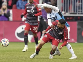 Toronto FC's Lorenzo Insigne, right, battles for the ball with Charlotte FC's Kerwin Vargas during first half MLS action in Toronto, Saturday, March 9, 2024.