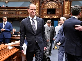 Quebec Finance Minister Eric Girard walks in to present his provincial budget at the National Assembly on Tuesday.