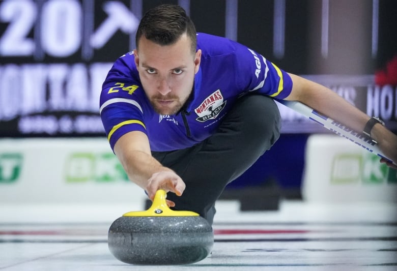 A male curling skip delivers a stone with his right hand.