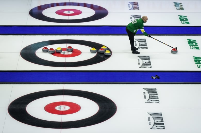 A man plays curling