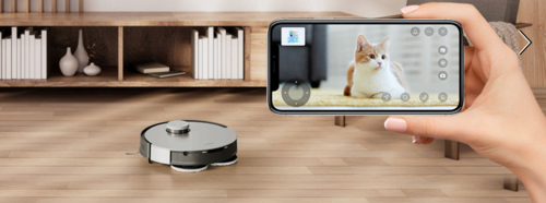 A person using a phone to access live footage from a robot vacuum.