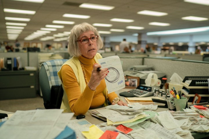 Deirdre holds up a receipt in Everything Everywhere All at Once.