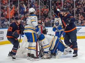 Ryan Nugent-Hopkins (93) and Zach Hyman (18)of the Edmonton Oilers, celebrate a first period goal against the Buffalo Sabres at Rogers Place in Edmonton on March 21, 2024. Photos by Shaughn Butts-Postmedia