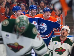 Connor McDavid (97), Evan Bouchard (2) and Zach Hyman ce;ebrate a goal with a dejected Marc-Andre Fleury in the foreground