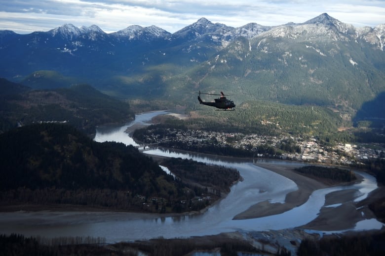 A Royal Canadian Air Force helicopter surveys the Fraser Valley after rainstorms lashed the western Canadian province of British Columbia, triggering landslides and floods, shutting highways, near Abbottsford, B.C., Sunday, Nov. 21, 2021. 